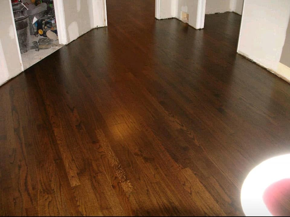 Restored hardwood floor with a dark stain